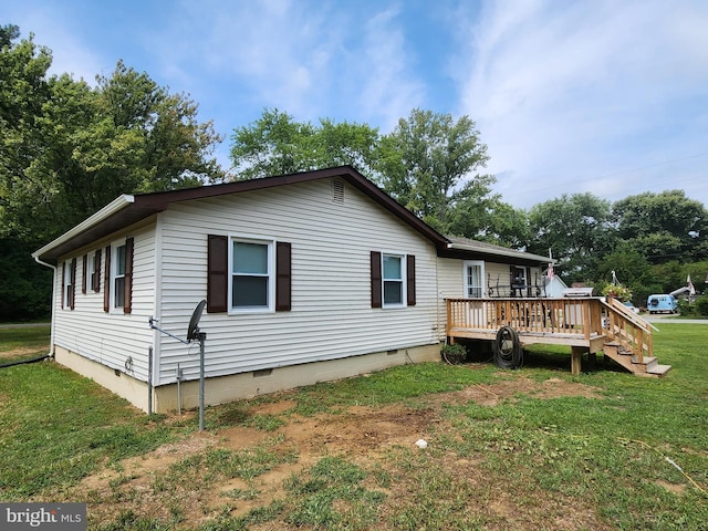 view of property exterior featuring a deck, a yard, and crawl space