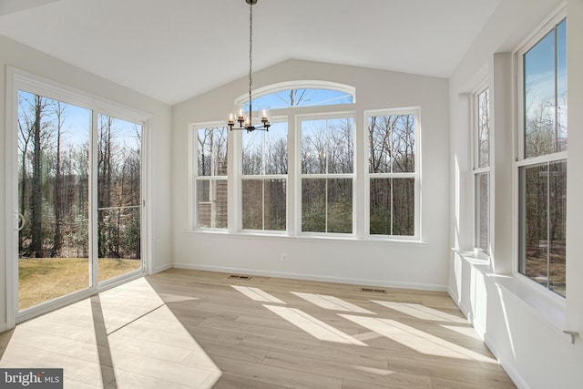 unfurnished sunroom with visible vents, vaulted ceiling, and a notable chandelier