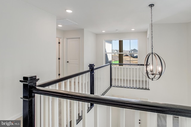 stairs with recessed lighting, visible vents, and baseboards