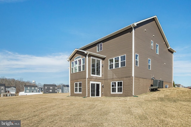 back of house featuring a yard