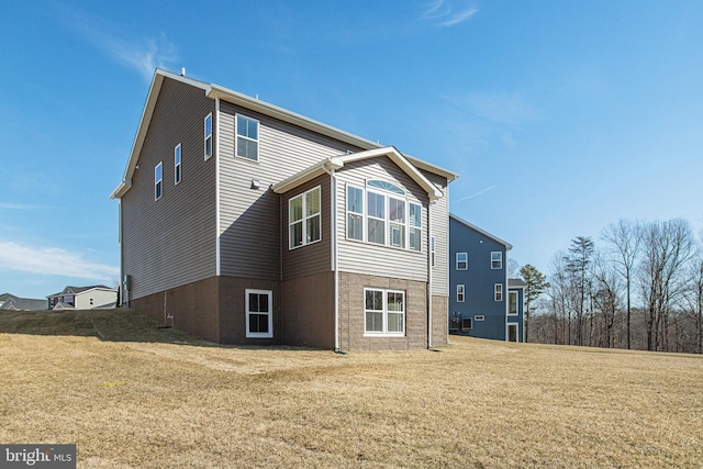 view of property exterior with a yard