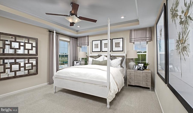 bedroom with a tray ceiling, recessed lighting, ornamental molding, carpet flooring, and baseboards