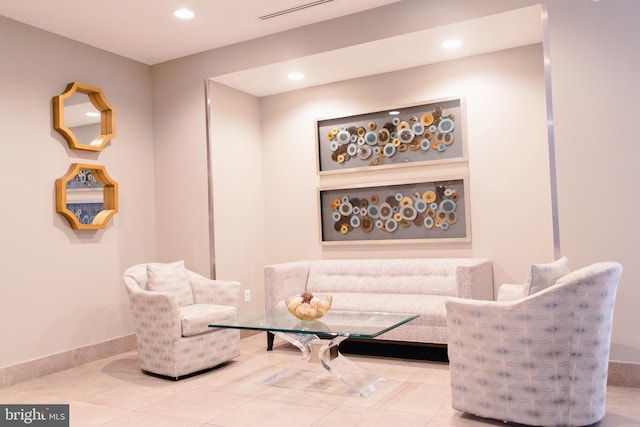 living area with tile patterned floors