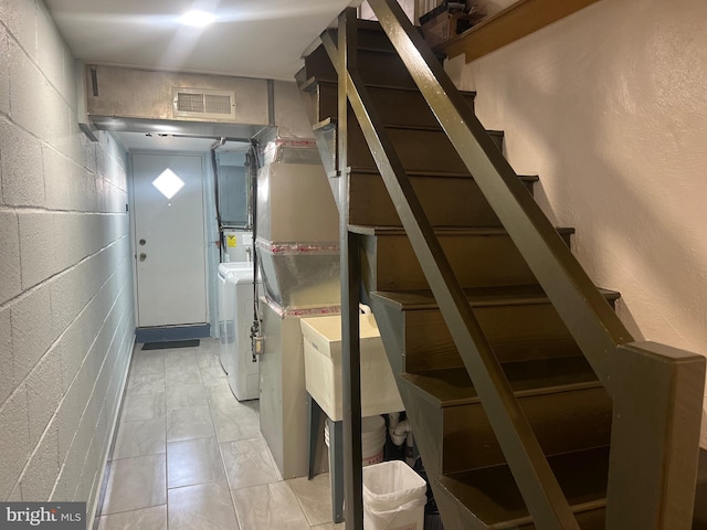 washroom with light tile patterned floors