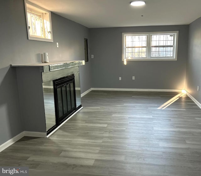 unfurnished living room featuring hardwood / wood-style flooring