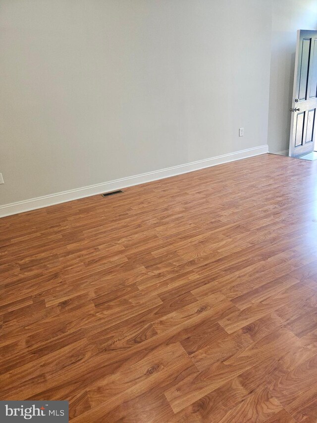 kitchen featuring dark wood-type flooring, white cabinets, appliances with stainless steel finishes, and sink