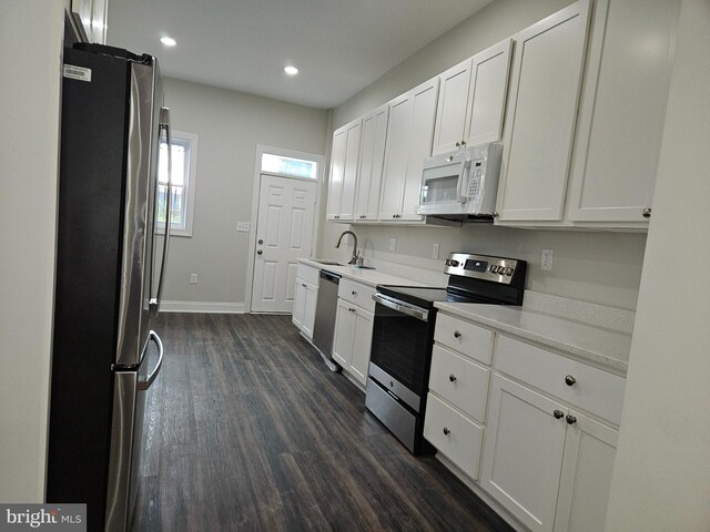 bathroom with toilet and hardwood / wood-style flooring