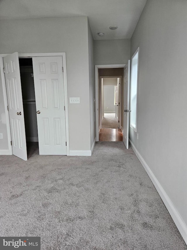 unfurnished bedroom featuring carpet flooring