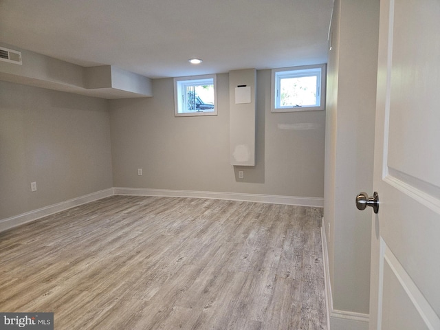 basement with light wood-type flooring