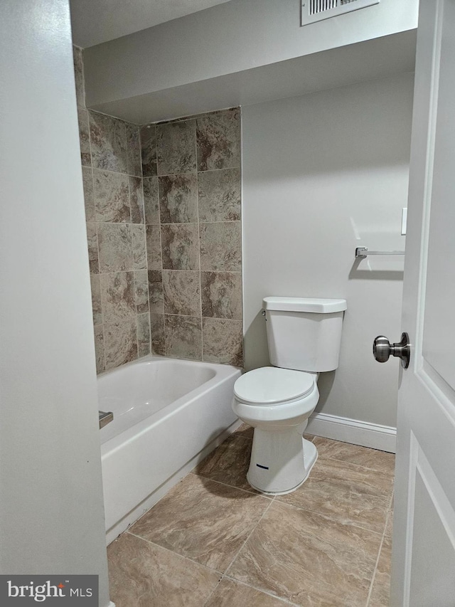 bathroom featuring toilet and shower / bathing tub combination