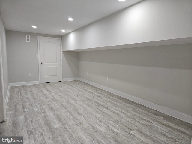 basement featuring light hardwood / wood-style floors