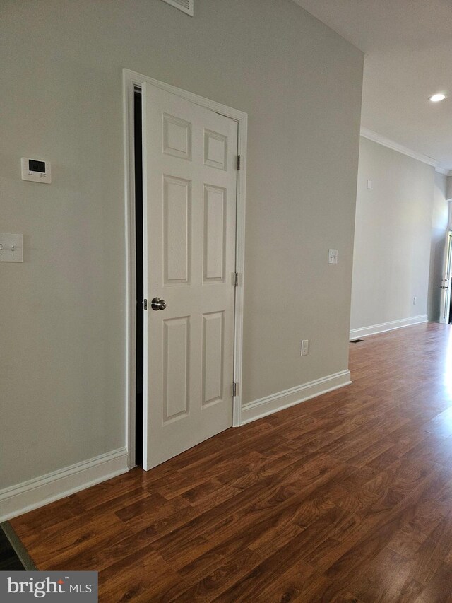 kitchen with appliances with stainless steel finishes, sink, white cabinets, and dark hardwood / wood-style floors