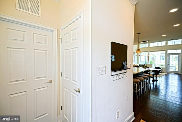 hallway featuring dark hardwood / wood-style floors