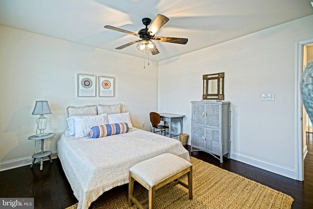 bedroom featuring ceiling fan and dark hardwood / wood-style flooring