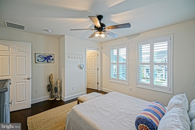 bedroom featuring dark hardwood / wood-style flooring and ceiling fan