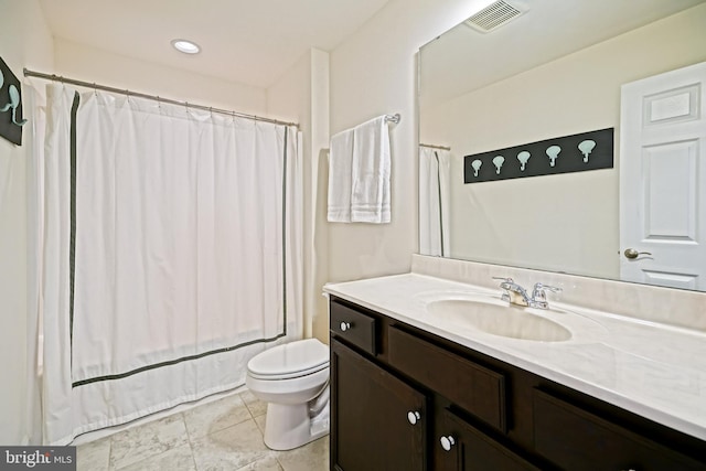 full bathroom featuring tile patterned flooring, vanity, toilet, and shower / bath combination with curtain