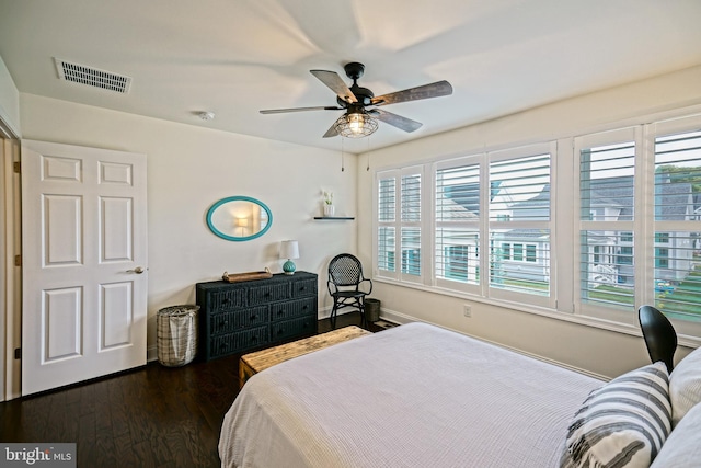 bedroom with dark wood-type flooring and ceiling fan