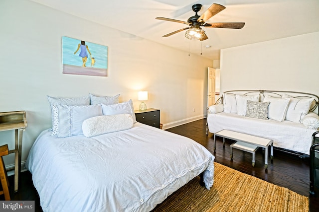 bedroom with ceiling fan and dark hardwood / wood-style flooring