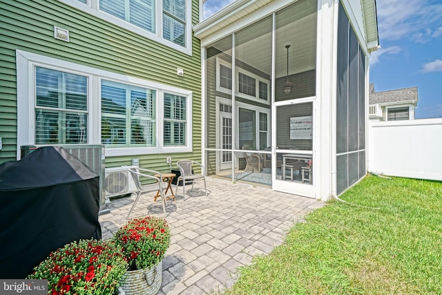 view of patio with a sunroom