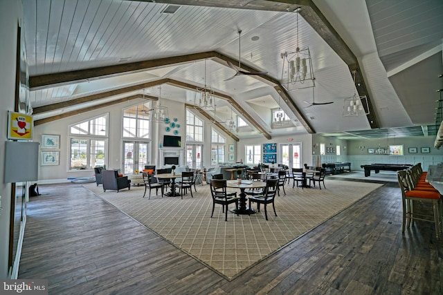 dining room with pool table, hardwood / wood-style floors, beam ceiling, high vaulted ceiling, and ceiling fan