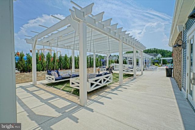 view of patio with outdoor lounge area and a pergola