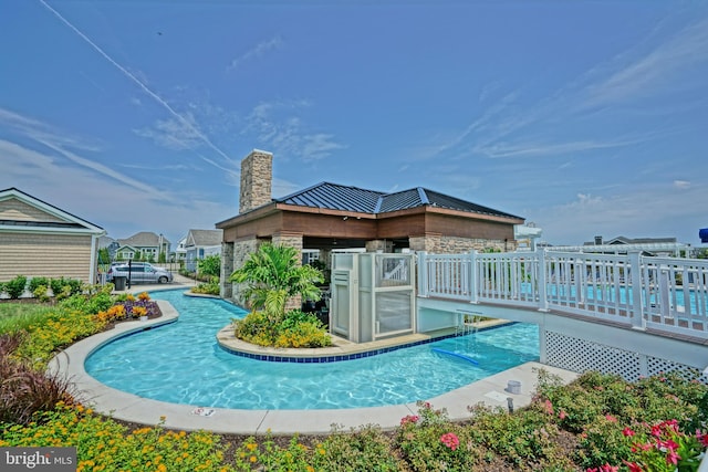 view of pool with a wooden deck