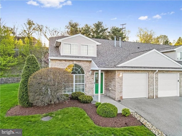 front of property with a garage and a front yard