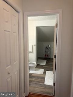 hallway with wood-type flooring