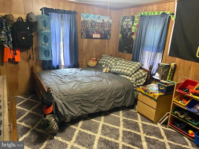 bedroom with wood walls