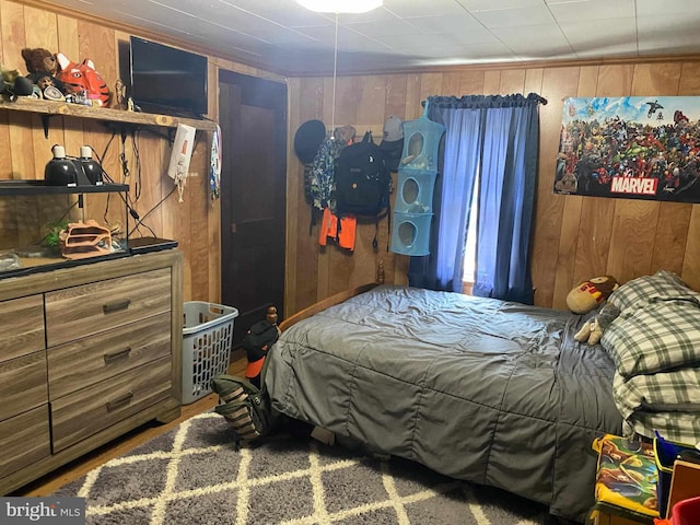 bedroom with wooden walls