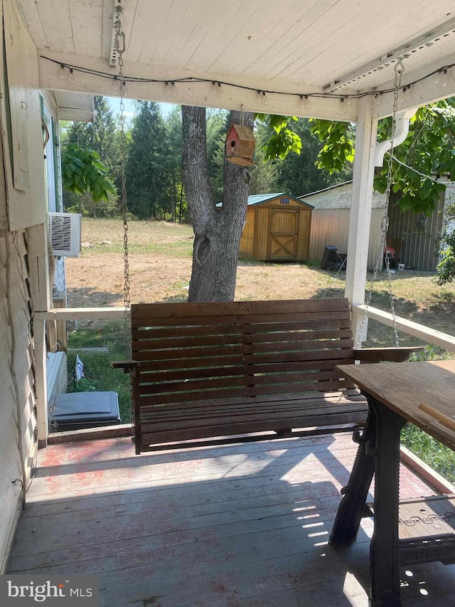 wooden deck with a shed