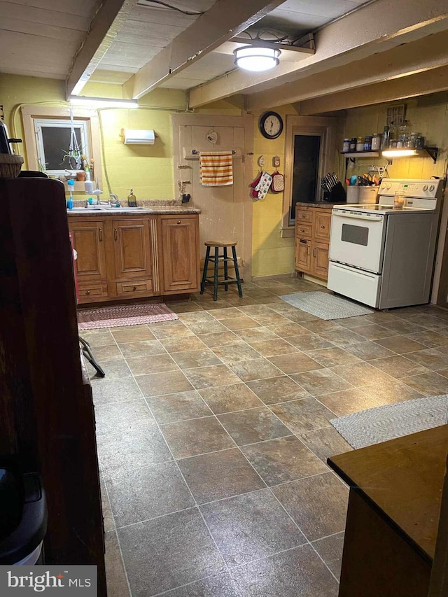 kitchen featuring tile patterned flooring, beam ceiling, and white range with electric cooktop