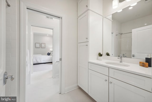 bathroom featuring vanity and a shower