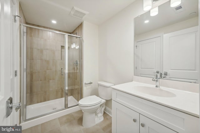 bathroom featuring vanity, toilet, and walk in shower