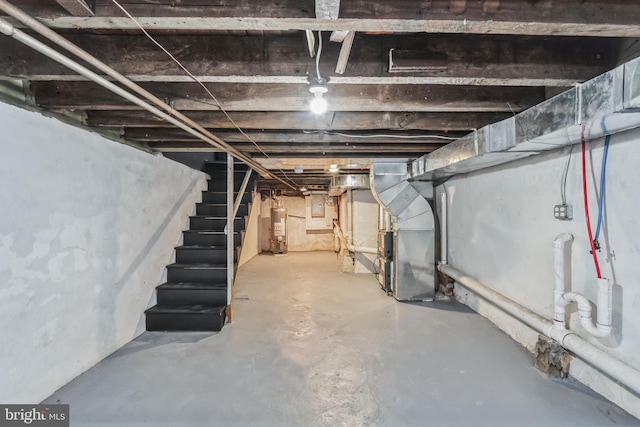 basement with water heater and heating unit