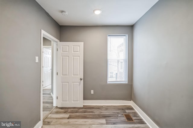 spare room featuring light hardwood / wood-style floors