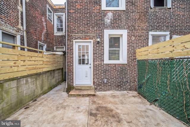 doorway to property featuring a patio area