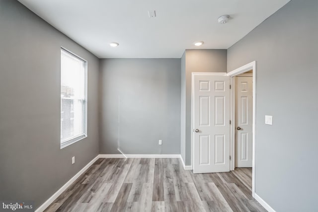 unfurnished room featuring light hardwood / wood-style floors