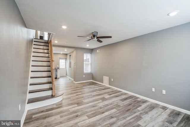 interior space with light hardwood / wood-style floors and ceiling fan