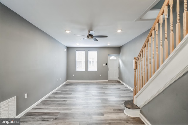 entryway with ceiling fan and light hardwood / wood-style floors