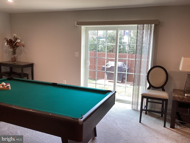 recreation room with light colored carpet