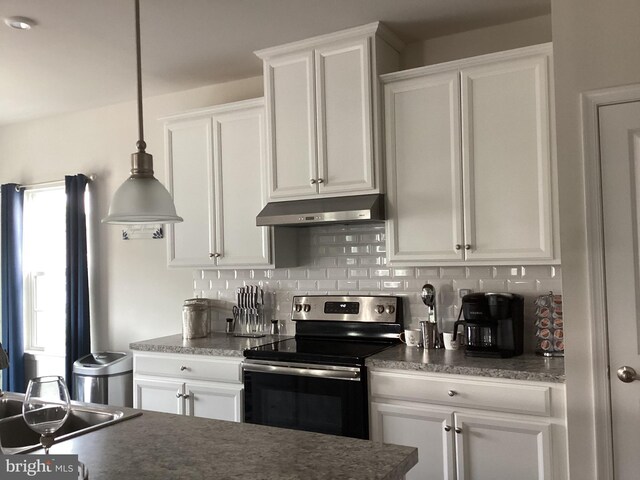 kitchen with white cabinetry, backsplash, sink, and electric range