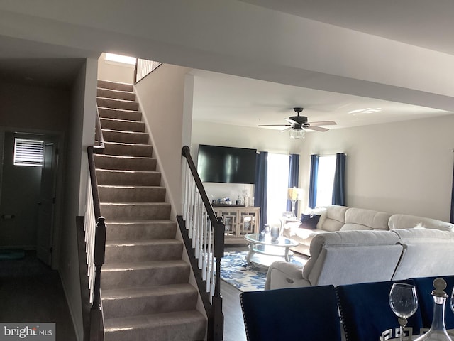 living room featuring ceiling fan