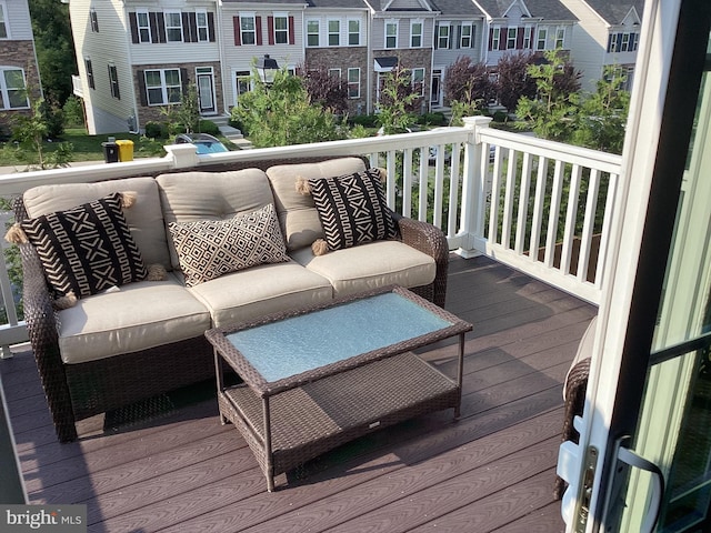 wooden terrace featuring outdoor lounge area