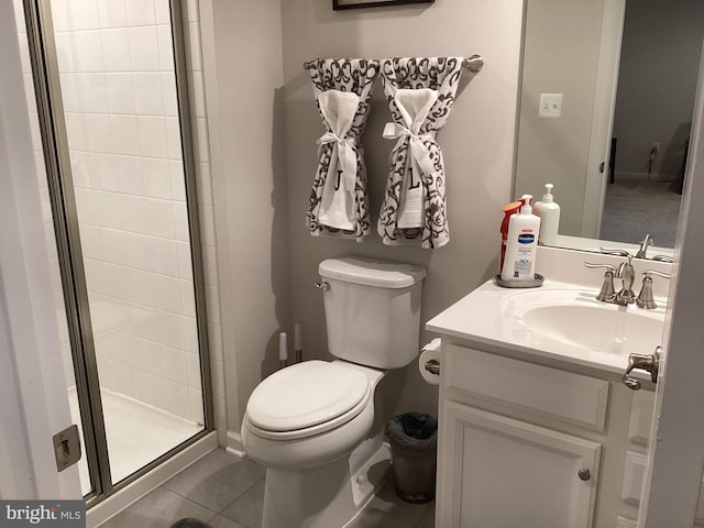 bathroom with vanity, an enclosed shower, tile patterned floors, and toilet