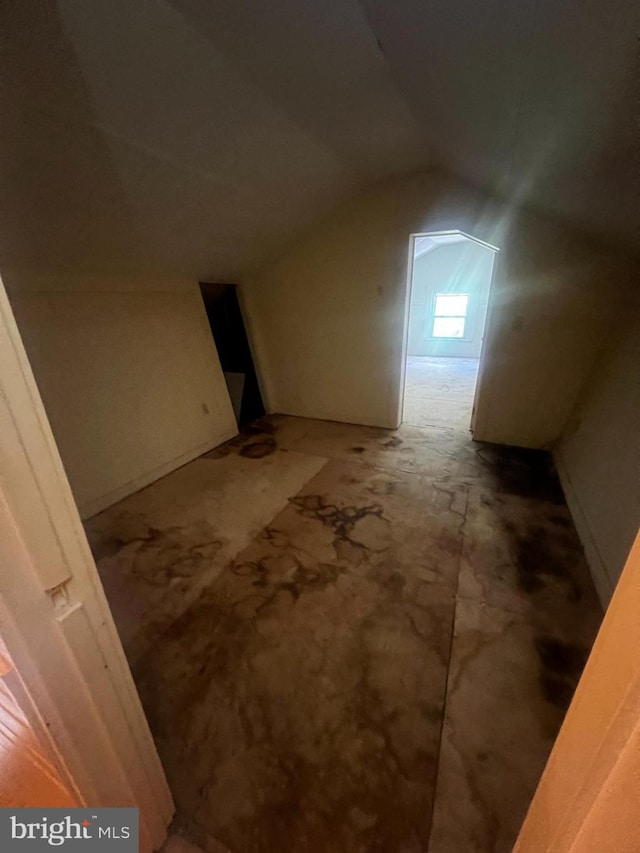 bonus room with vaulted ceiling