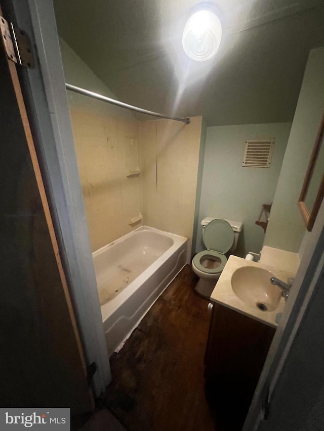 full bathroom featuring toilet, vanity, and shower / washtub combination