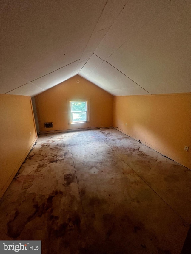 additional living space featuring vaulted ceiling