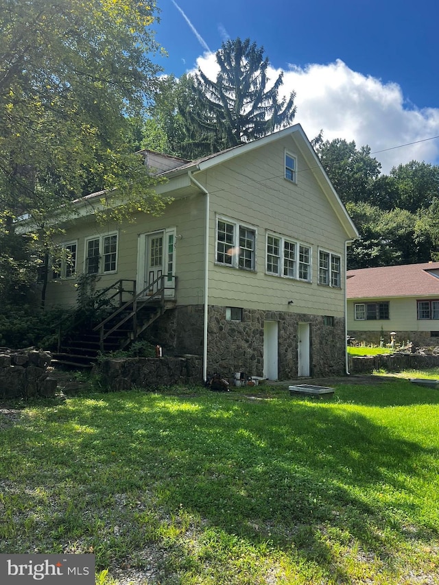 view of home's exterior featuring a yard