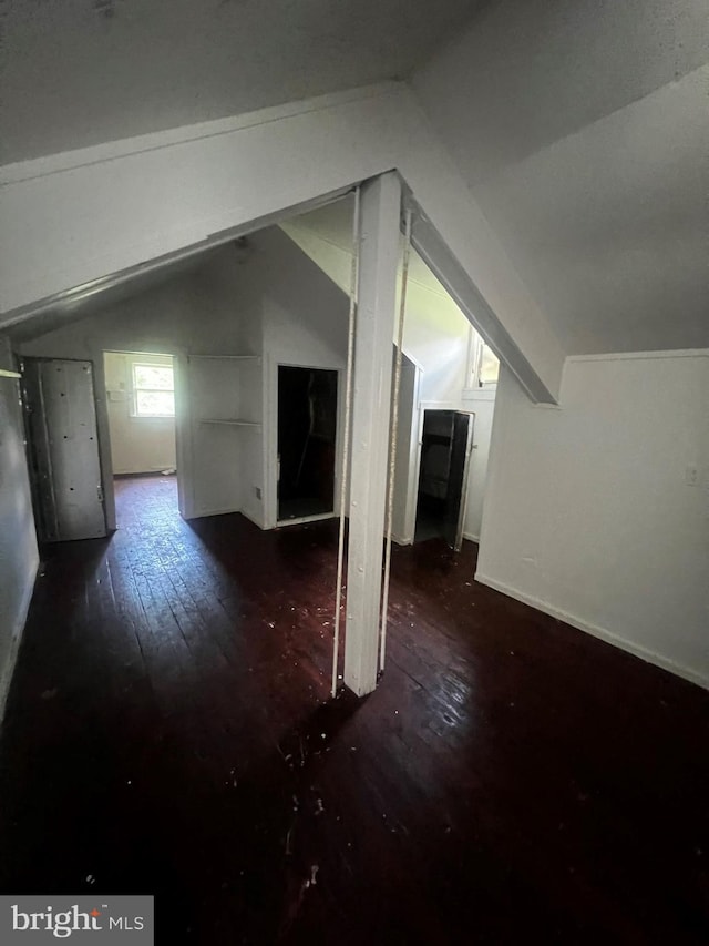 bonus room featuring wood-type flooring and lofted ceiling